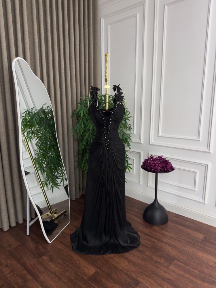Evening dress with draped design and luxurious embroidery