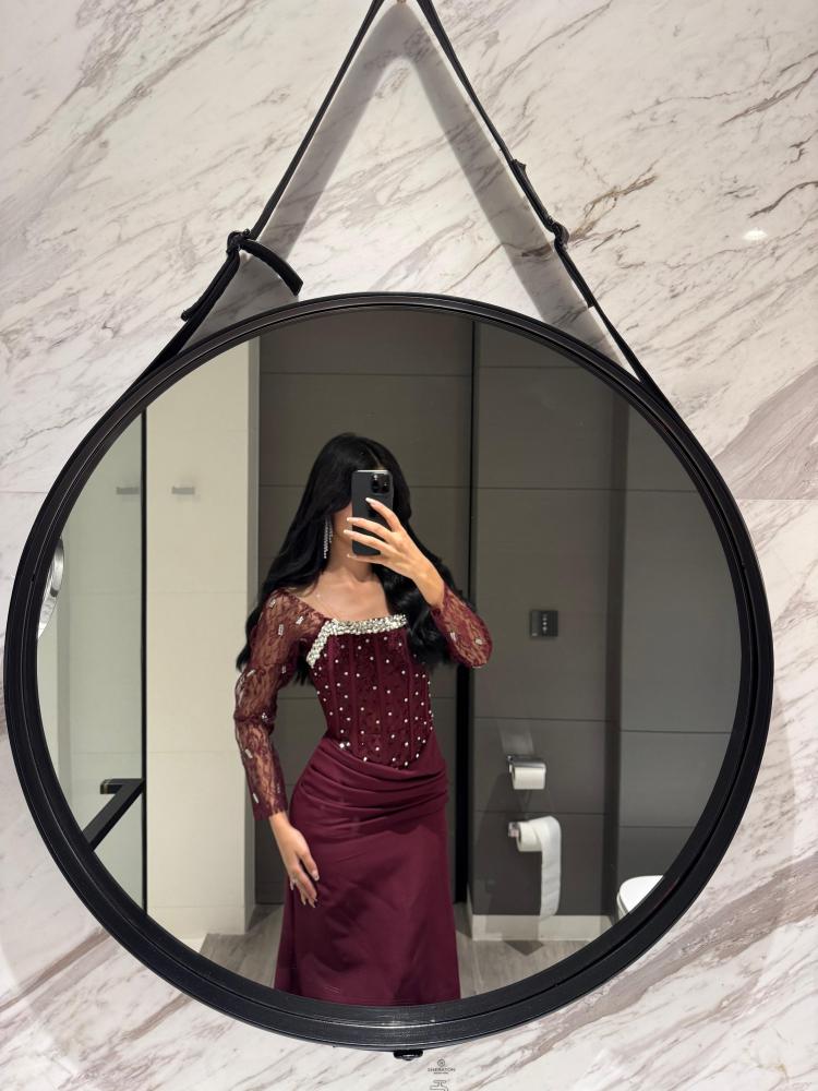 Elegant evening dress in luxurious maroon color