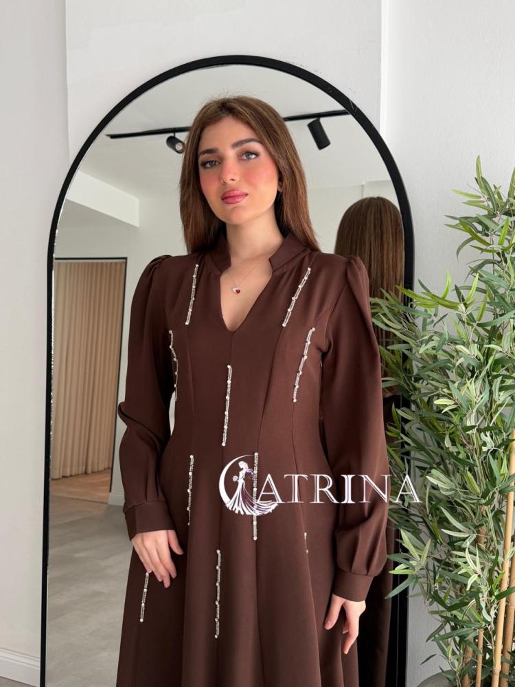 Elegant brown dress with vertical bead details and a sophisticated touch