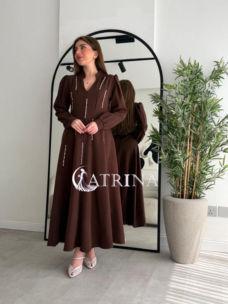 Elegant brown dress with vertical bead details and a sophisticated touch