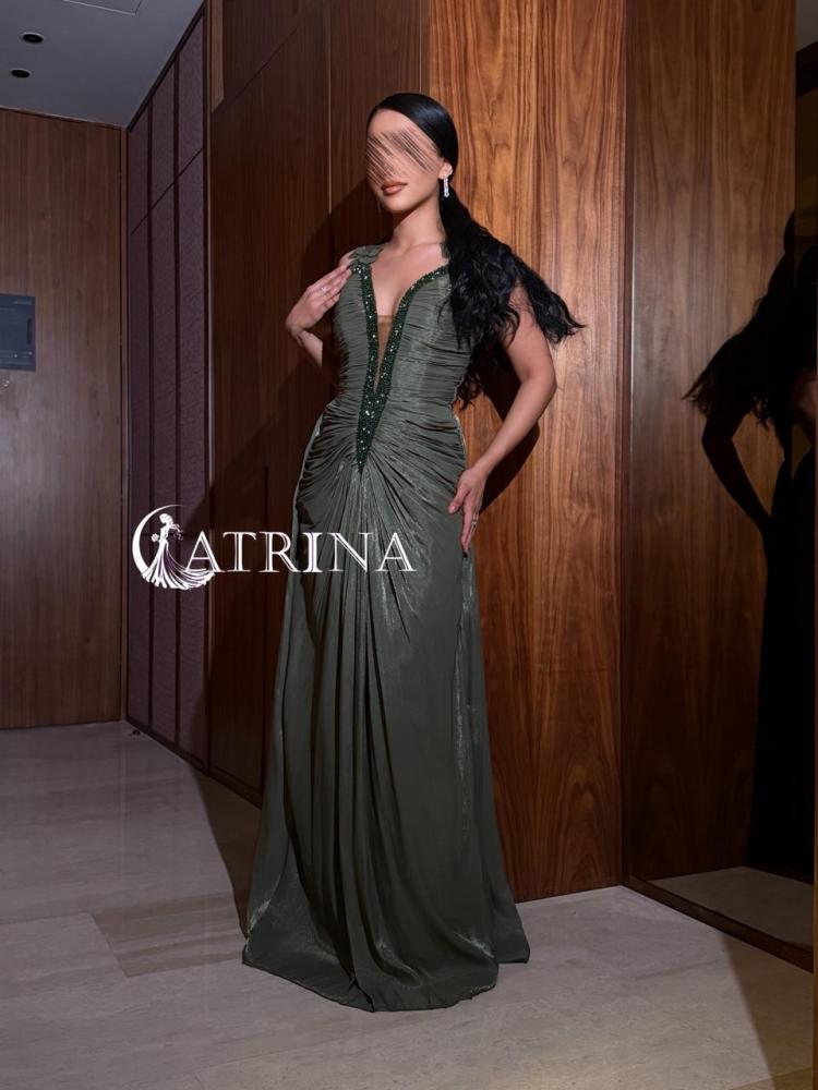 Evening dress with draped design and luxurious embroidery