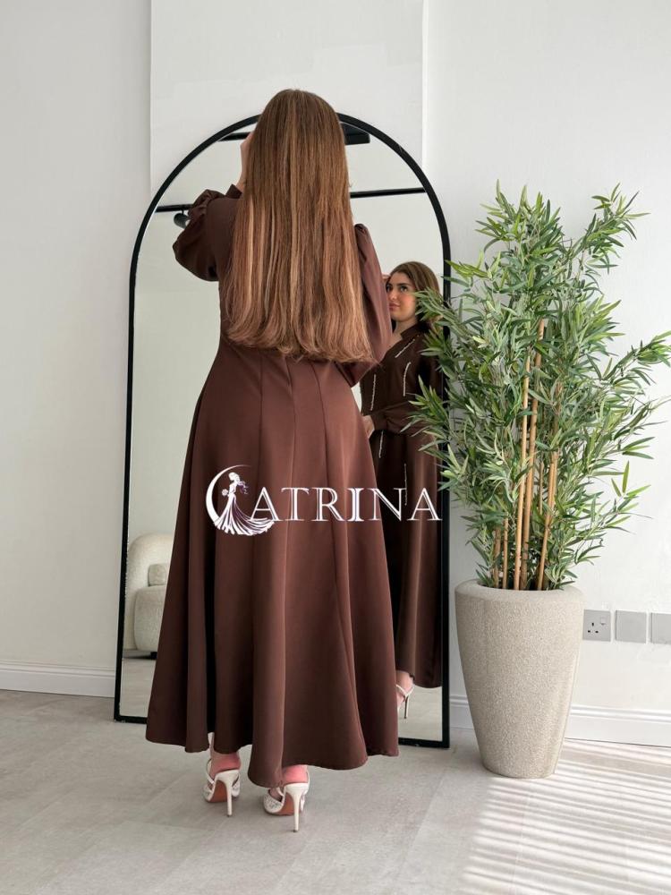 Elegant brown dress with vertical bead details and a sophisticated touch