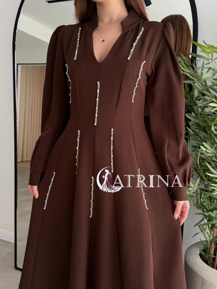 Elegant brown dress with vertical bead details and a sophisticated touch