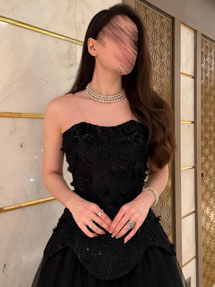 Black evening dress with embroidered corset