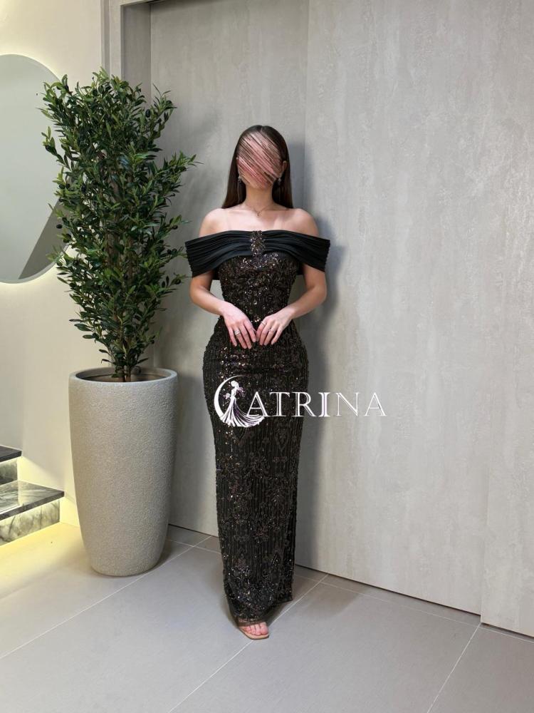 Long evening dress with luxurious embroidery and off-shoulder design