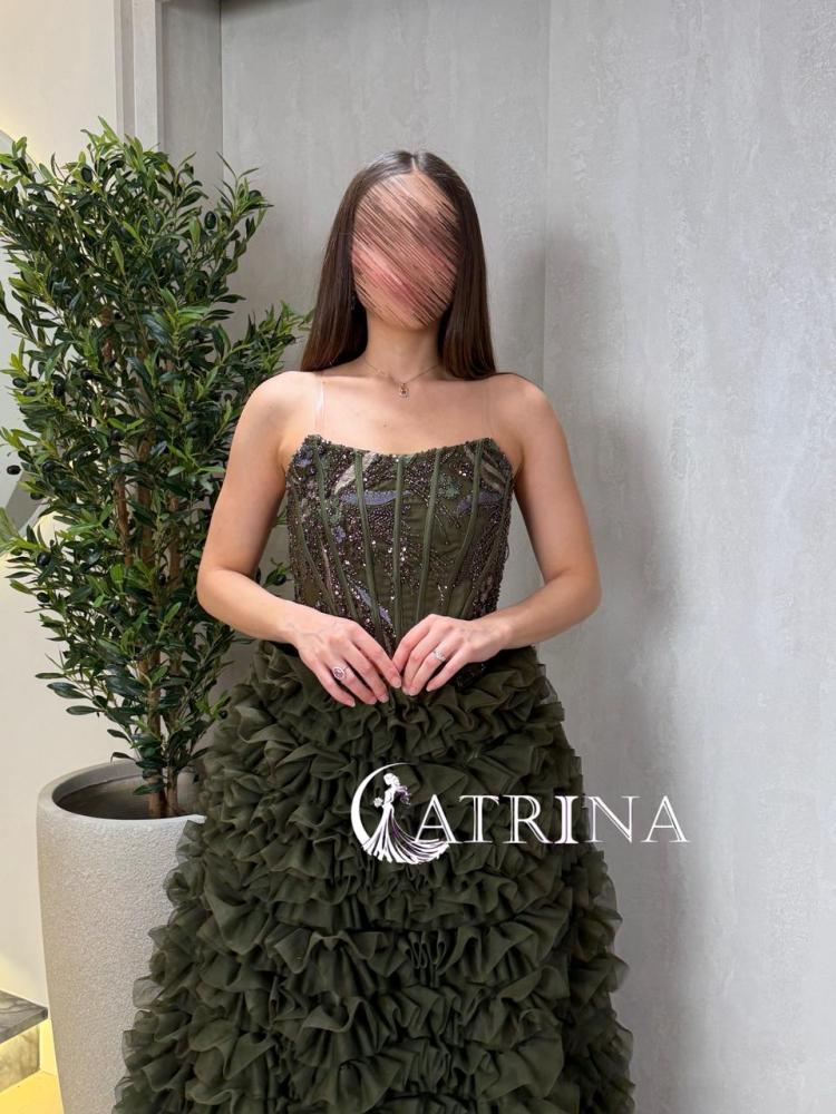 Luxury evening dress in olive color with a corset design and ruffled skirt