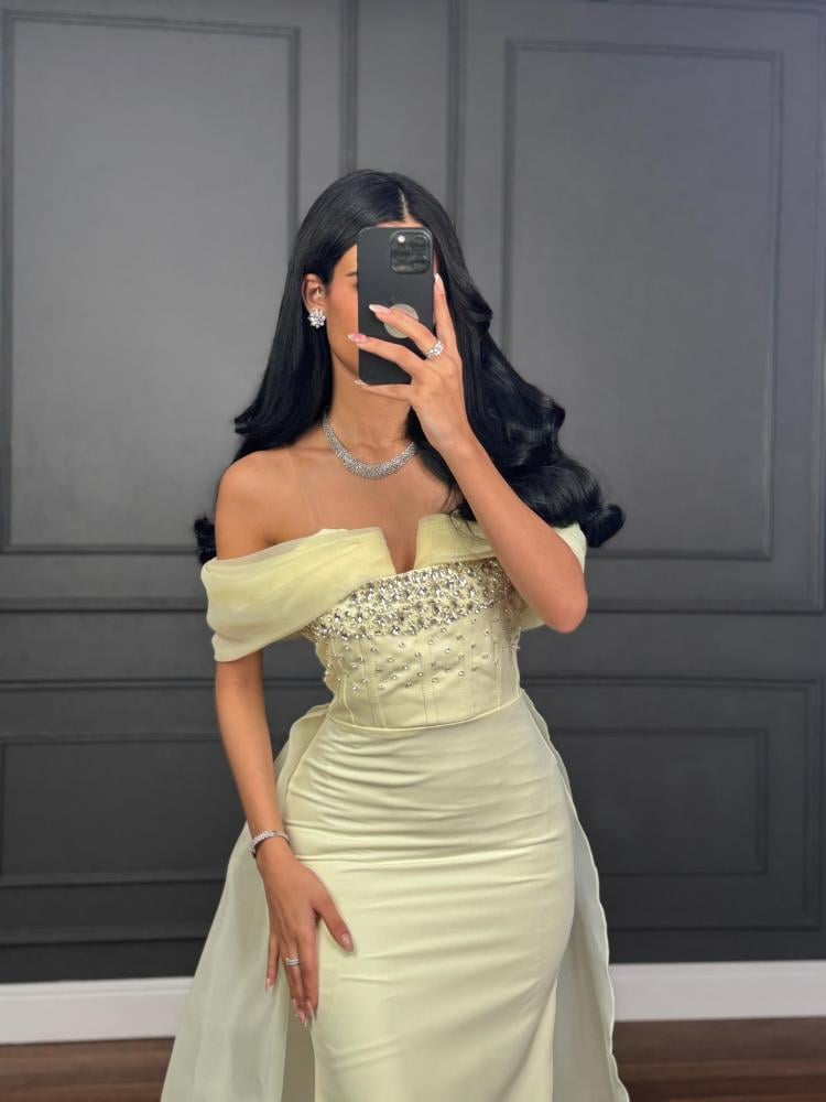Elegant evening dress in light lemon color