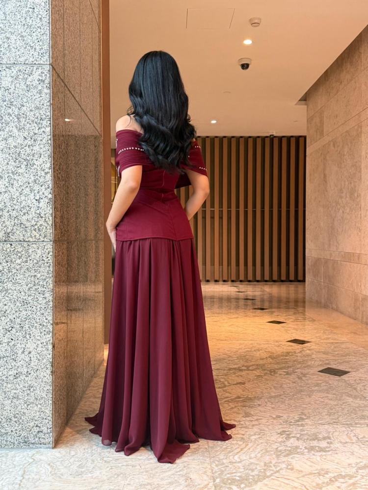Maroon off-shoulder dress decorated with shiny rhinestones