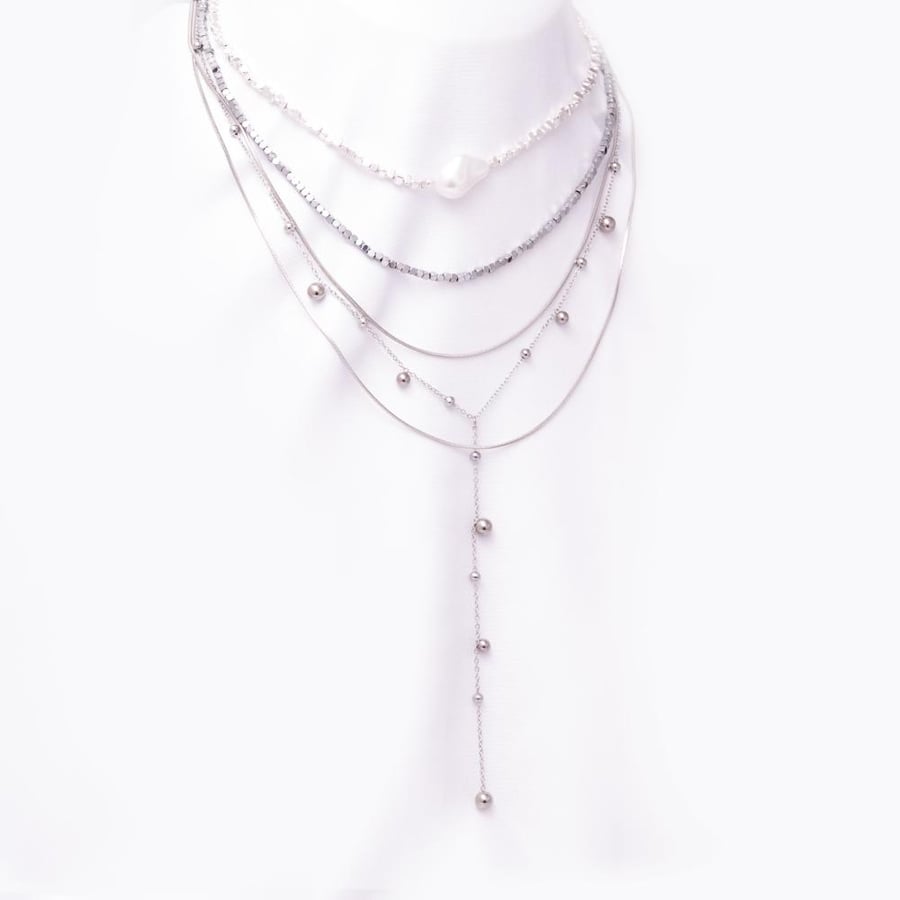 Layered beaded necklace with a large pearl centerpiece