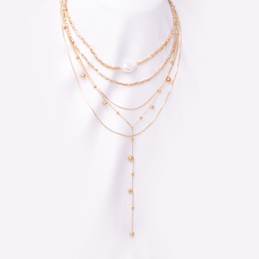 Layered beaded necklace with a large pearl centerpiece