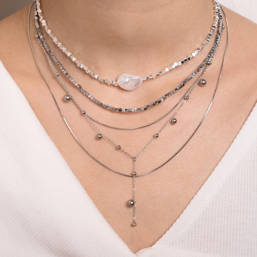 Layered beaded necklace with a large pearl centerpiece