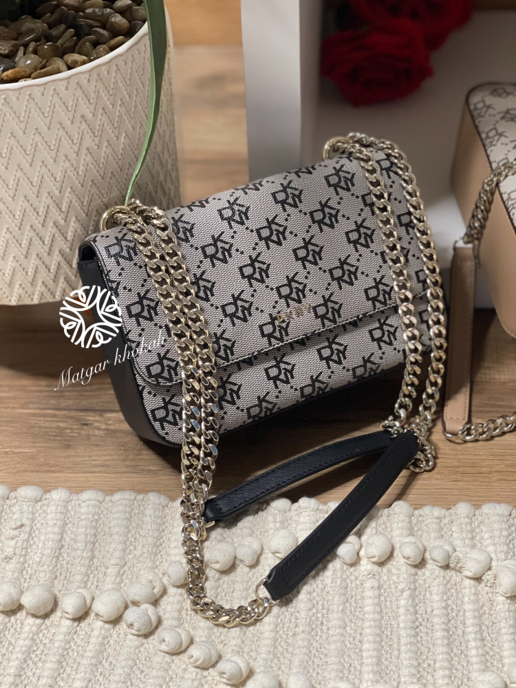 Darkini black bag with logo, shoulder and crossbody wear