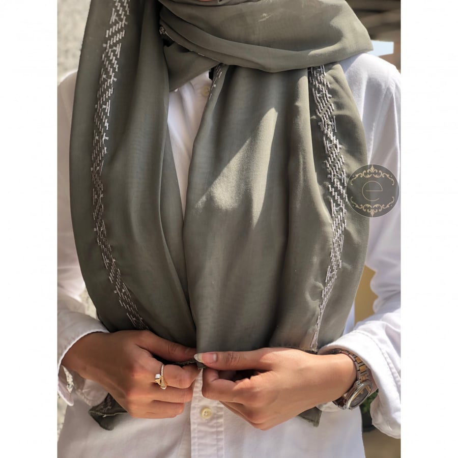 A soft green color with elegant and distinctive embroidery.