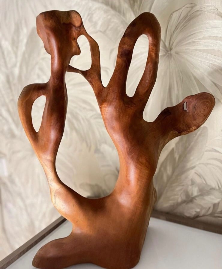 A carved artistic piece from teak wood