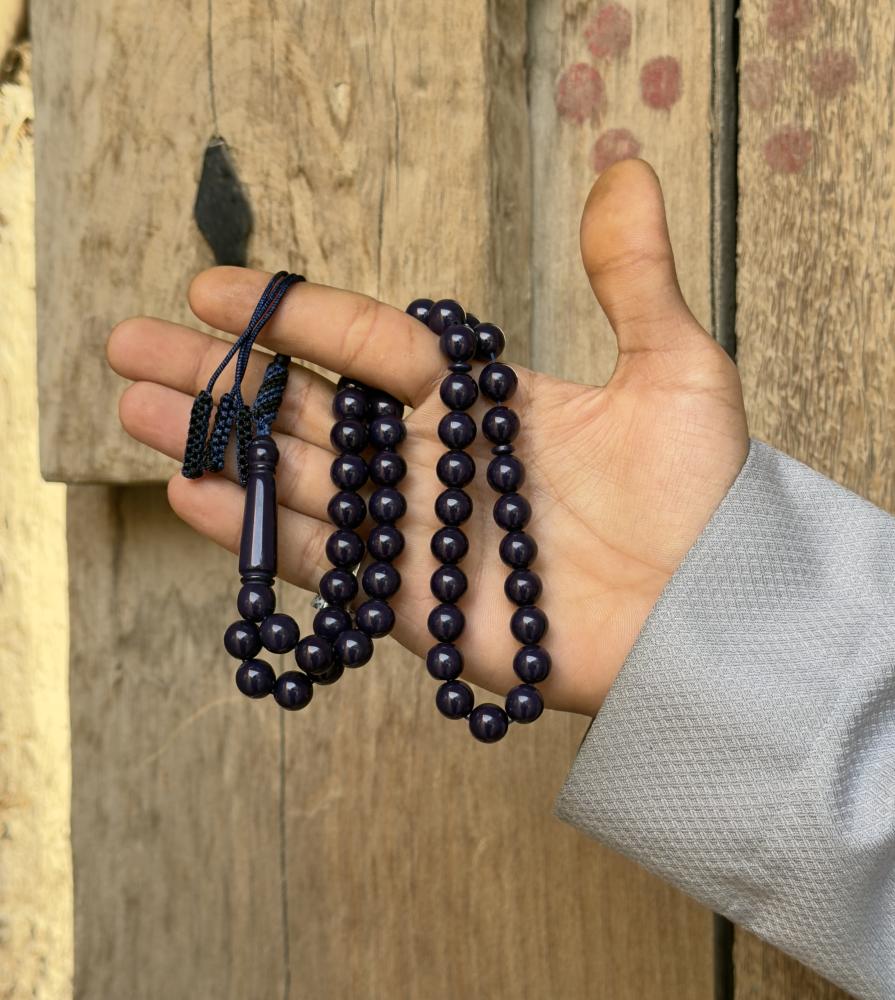A dark blue beaded rosary