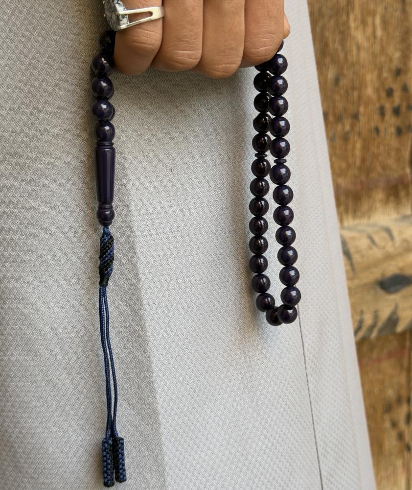 A dark blue beaded rosary