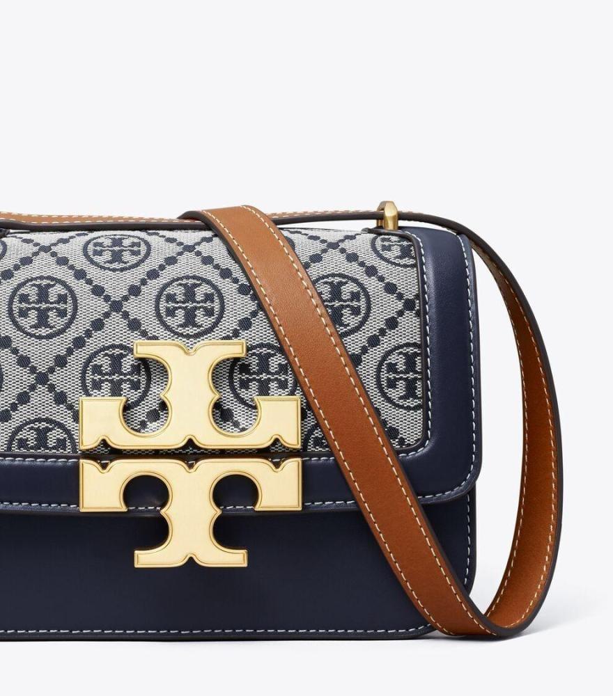 حقيبة كتف نسائية كحلي بنقشة كلاسيكية وإبزيم ذهبي فاخر من Tory Burch
