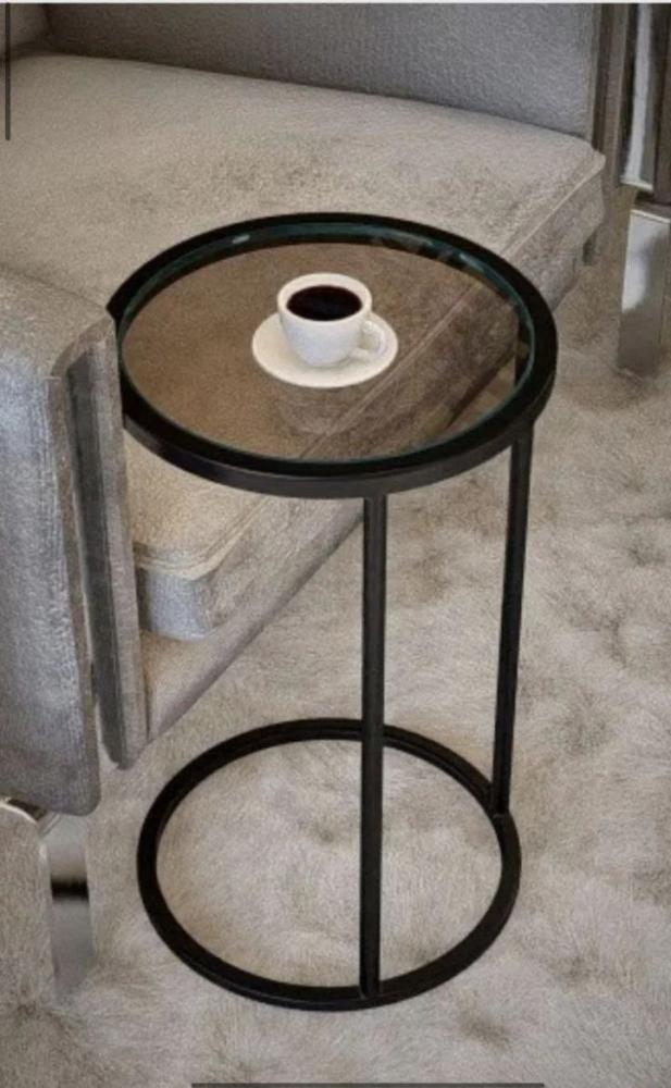 Service table with iron surface and caramel glass top