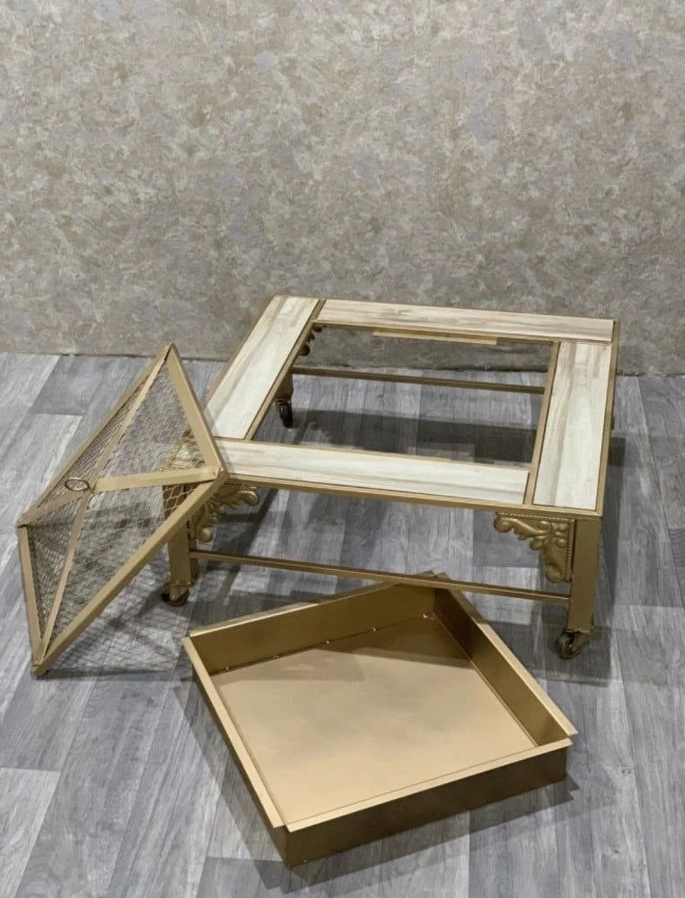 Golden iron brazier with wheels