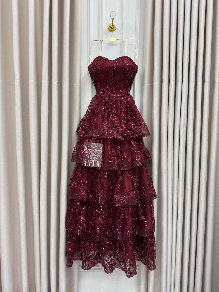 Secrets of an orange evening dress with layered embroidery and shiny sequins