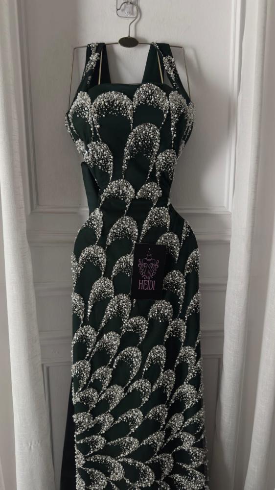 Create an elegant evening dress in olive green embroidered with luxurious silver beads