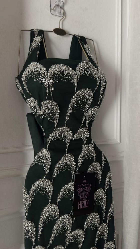 Create an elegant evening dress in olive green embroidered with luxurious silver beads