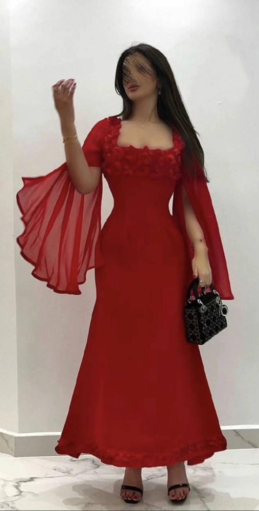 Al-Hanouf luxurious red evening dress with raised embroidery and chiffon cape sleeves