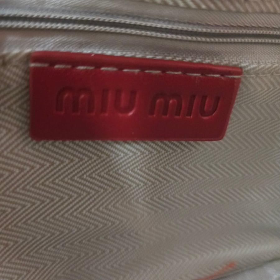 شنطة ميو ميو عنابي