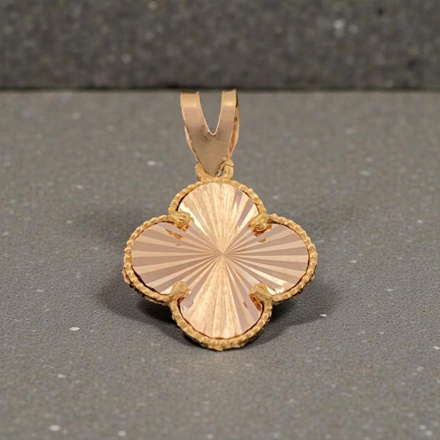A 21-karat gold pendant weighing 0.78 grams