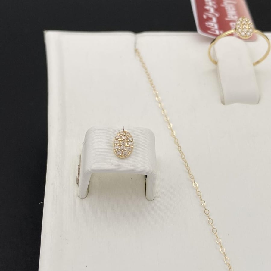 Half children's set of 18-karat gold weighing 1.26 grams