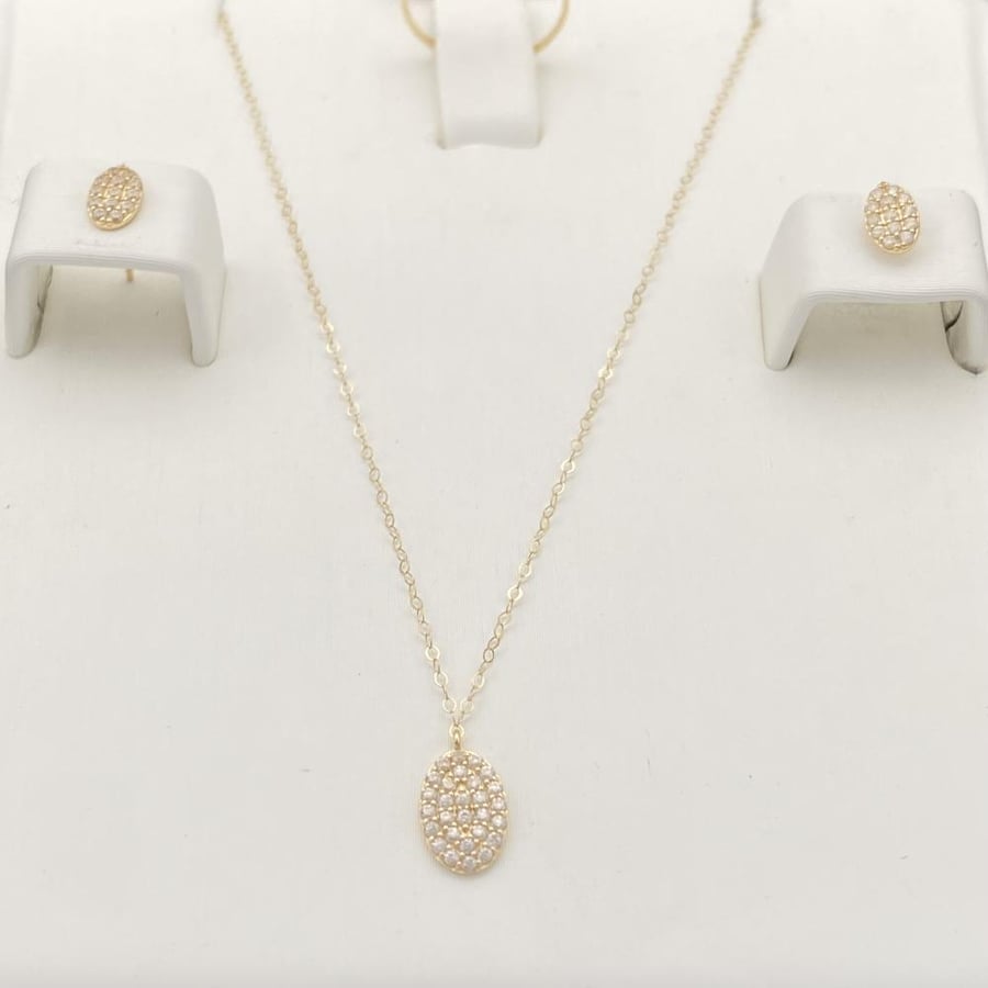 Half children's set of 18-karat gold weighing 1.26 grams