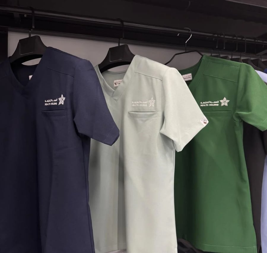 Embroidery of a logo upon request / Al-Sihha Holding Company logo / All health clusters