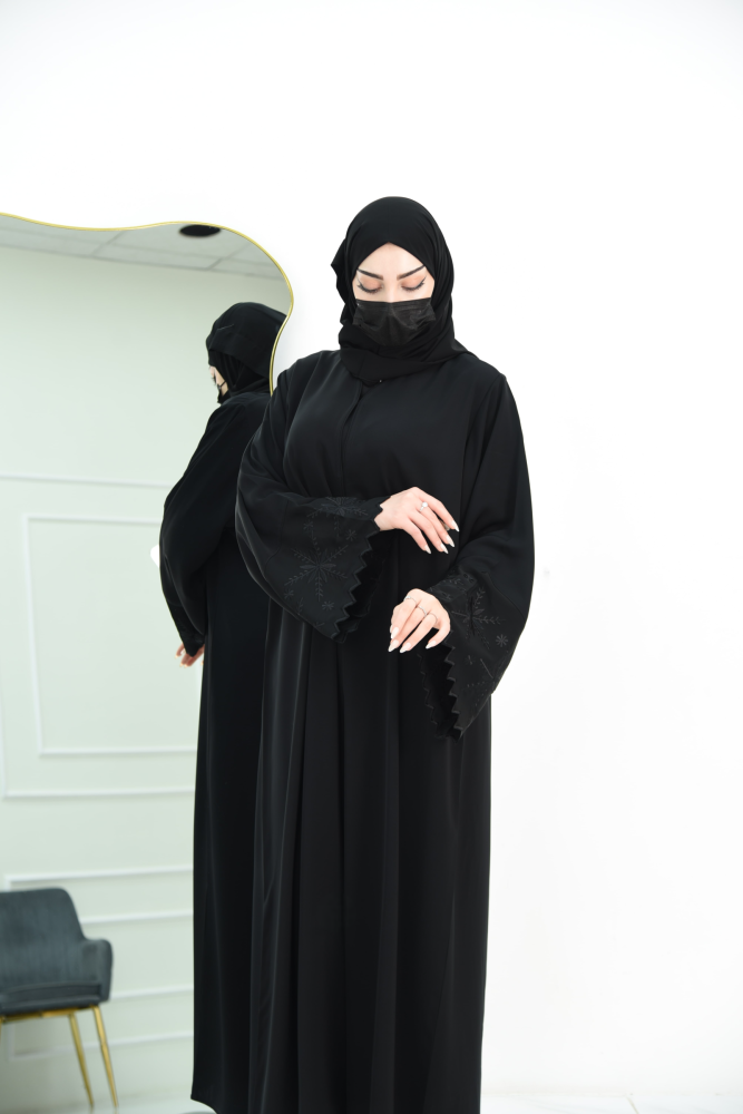 Black occasion abaya with embroidered sleeves and wavy edges