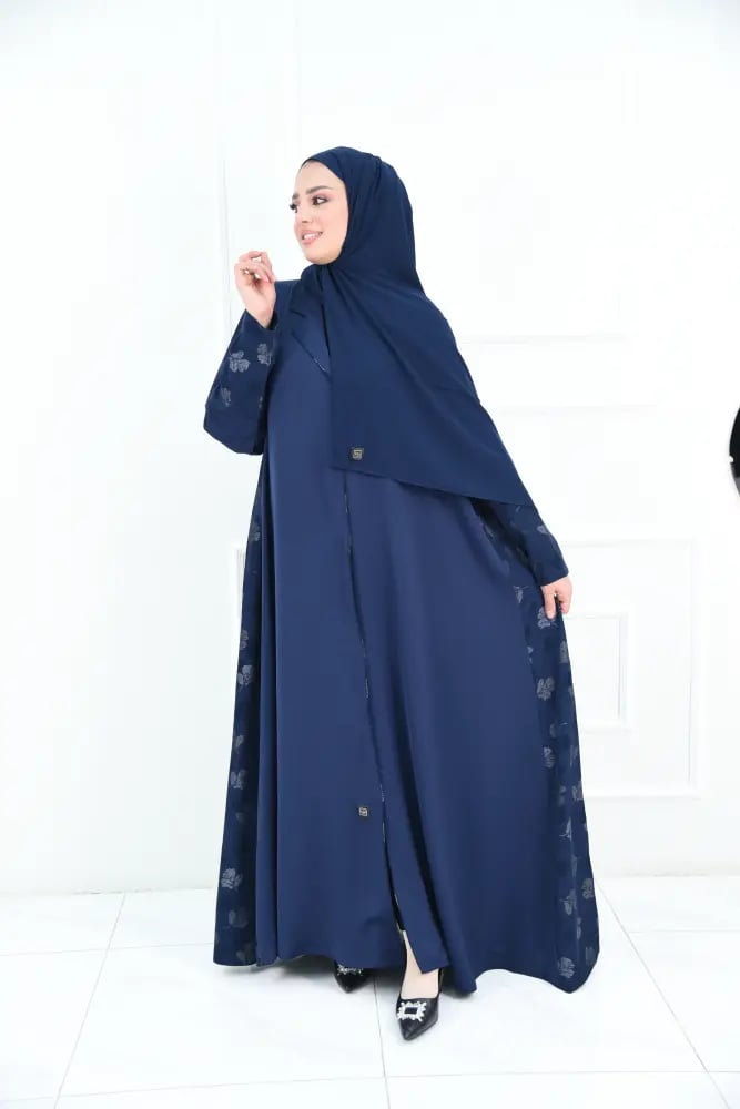 A full-length wide abaya in navy with silky rose fabric and leaf jacquard