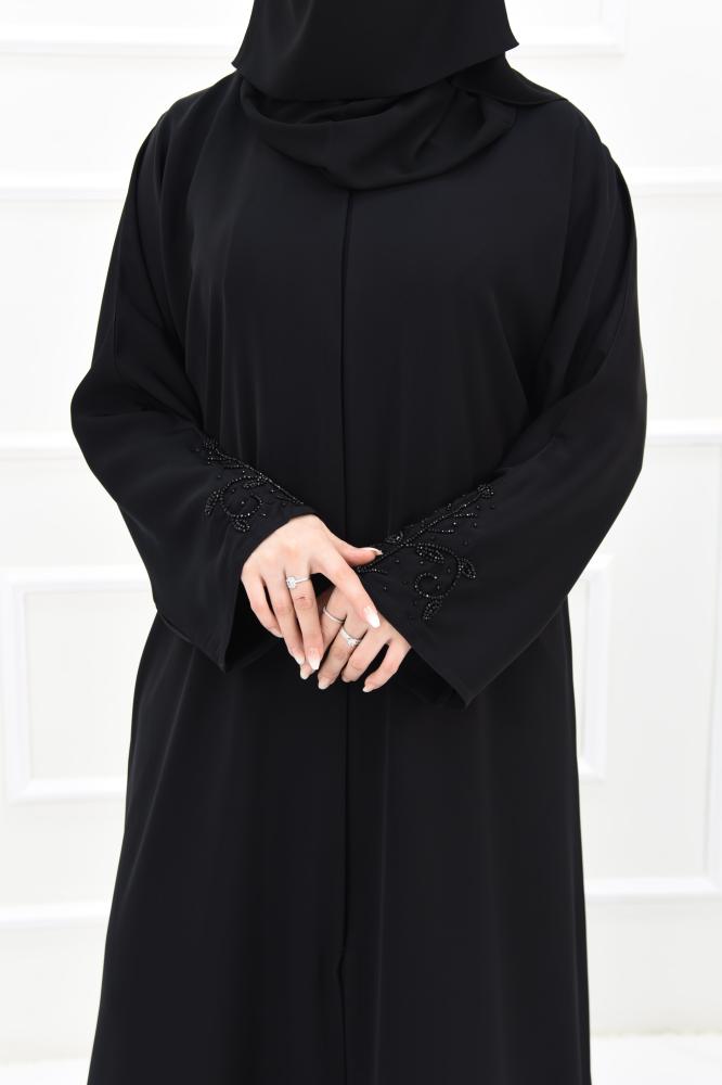 Black abaya with black embroidery and a navy slit at the back