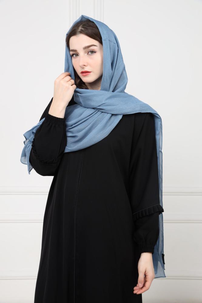 A blue emerald-colored headscarf with a shine