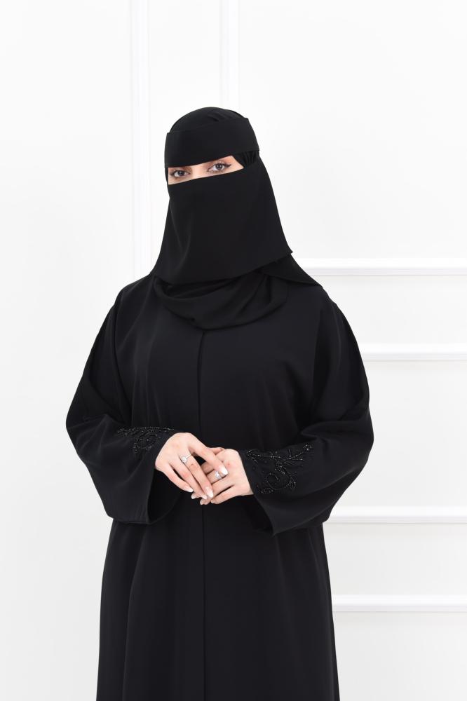 Black abaya with black embroidery and a navy slit at the back
