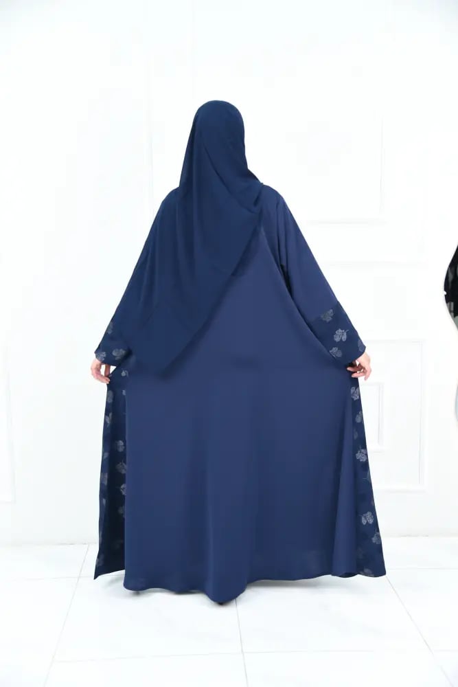 A full-length wide abaya in navy with silky rose fabric and leaf jacquard