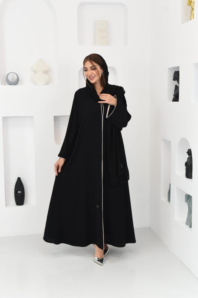A wide abaya decorated with embellishments