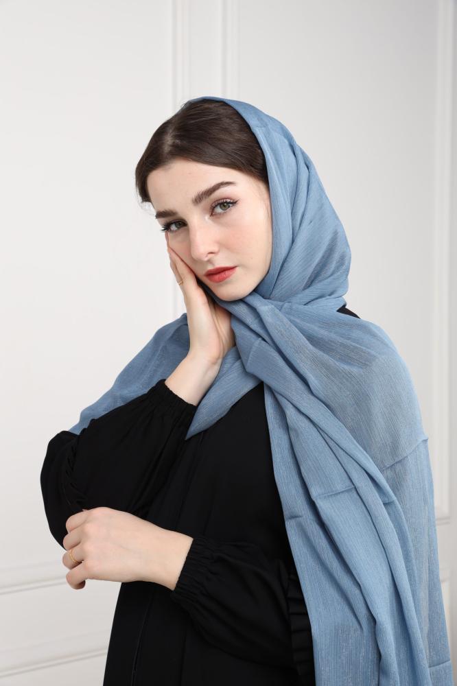A blue emerald-colored headscarf with a shine