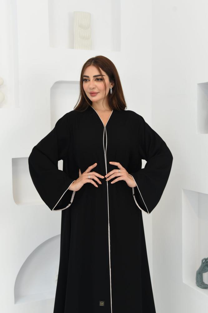 A wide abaya decorated with embellishments