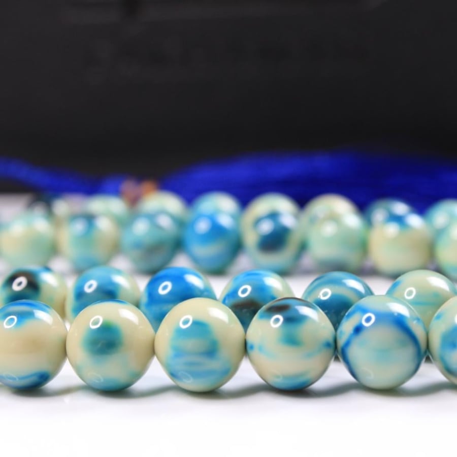 Turquoise coralized agate prayer bead with marble pattern