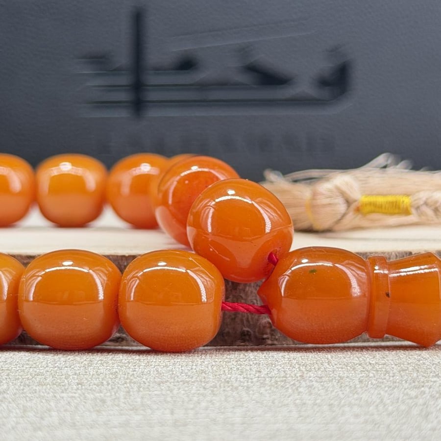 سبحة بكلايت عسلي مموج برميلي - 33 خرزة
