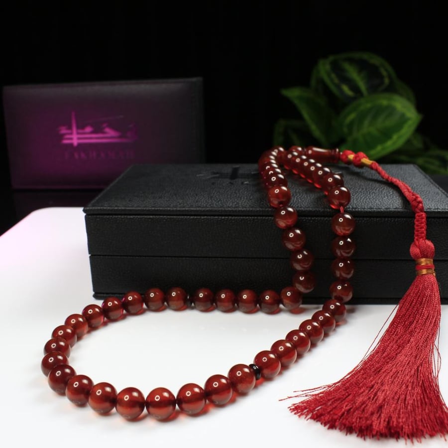 A rosary with crystal coral mixed with brown