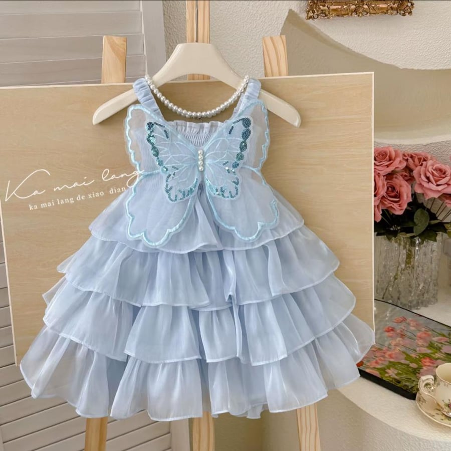 Sky blue butterfly dress – calm beauty with a royal touch