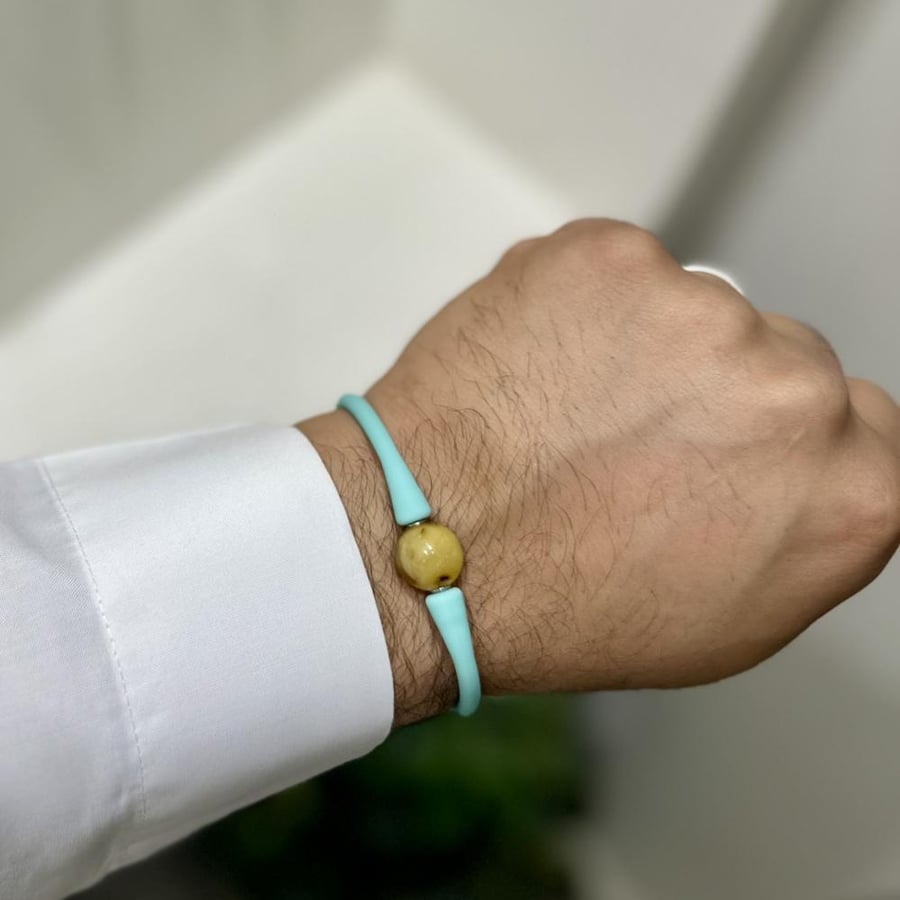 Amber bracelet with red rubber strap