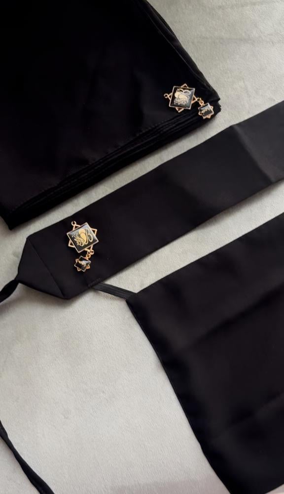 A niqab set with her black headscarf