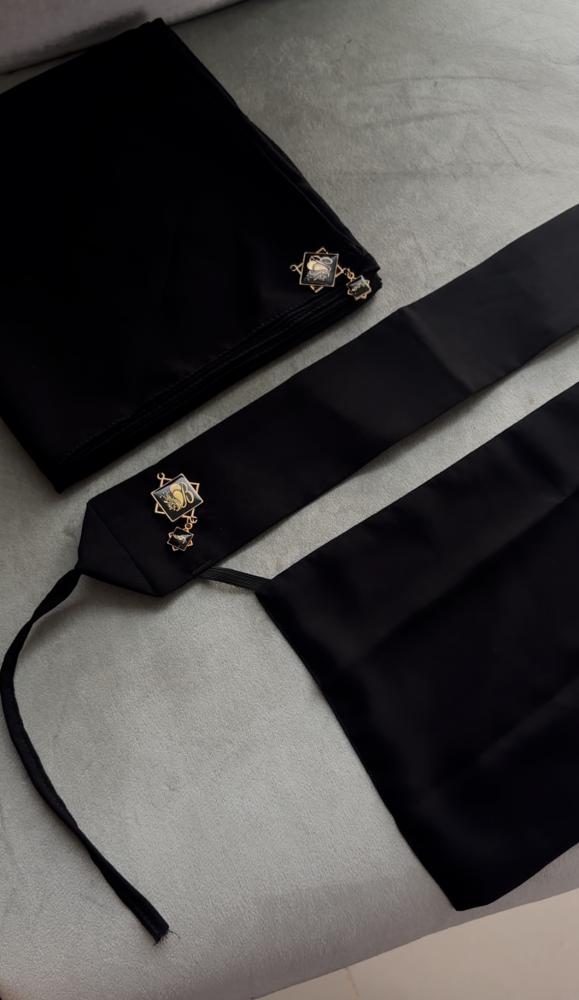 A niqab set with her black headscarf