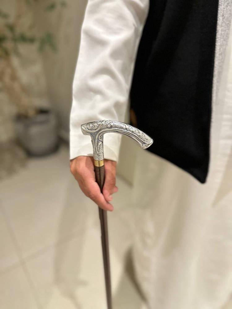 A stick with a half handle, large iron