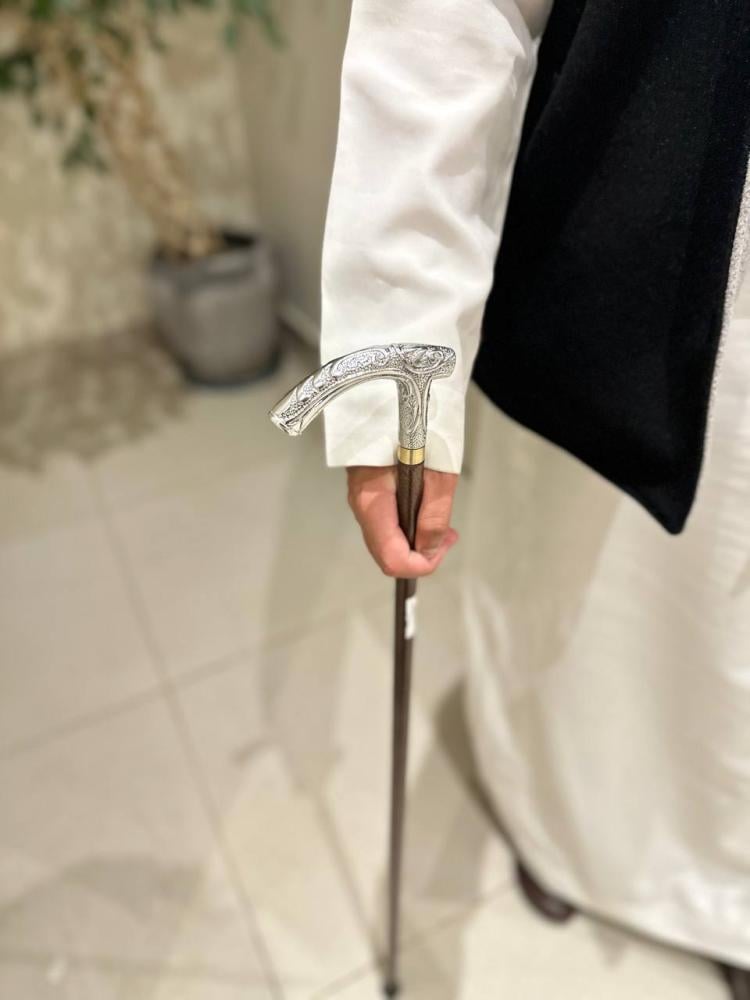 A stick with a half handle, large iron